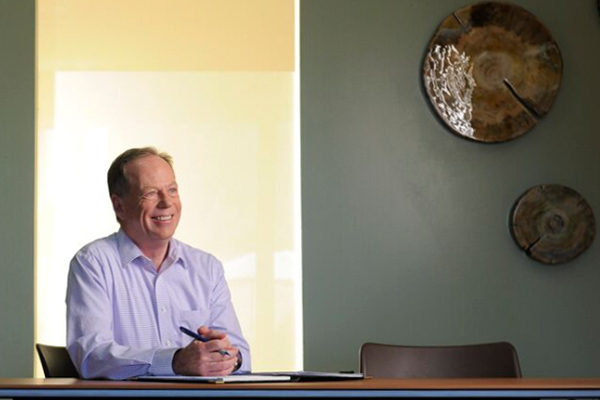 Image of Doctor Carl Clark sitting at his desk