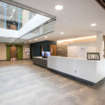 Image of the reception desk and entry way of Sanderson Apartments.