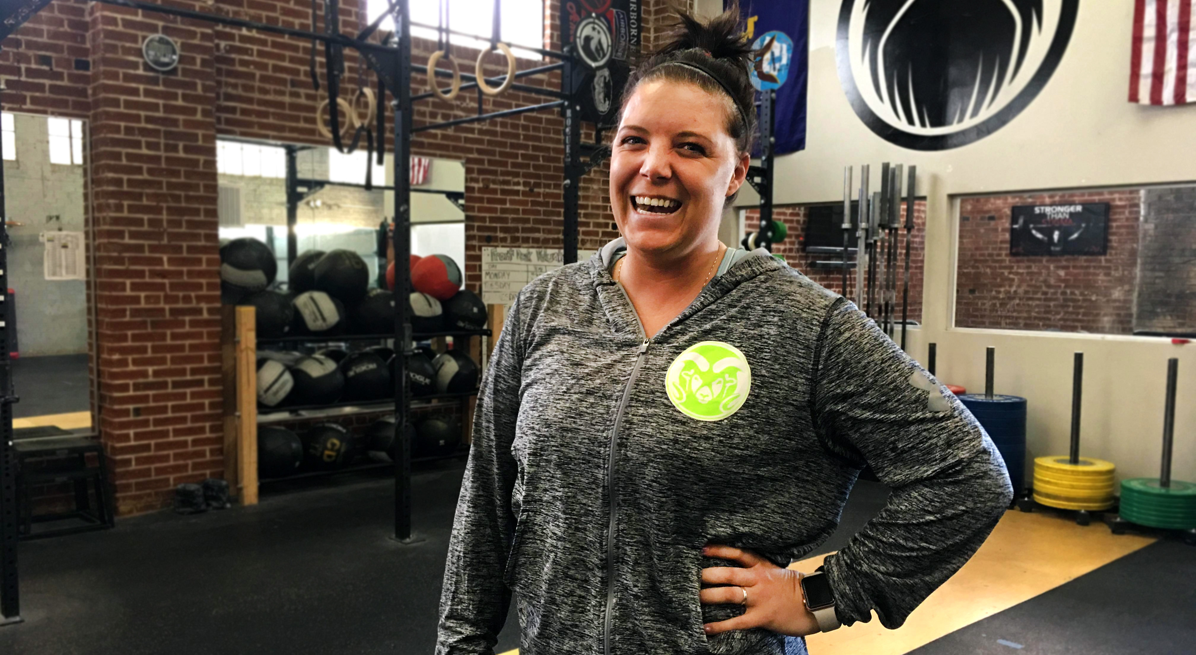 Katelyn Cole, PHASE project coordinator, stands inside The Phoenix gym.