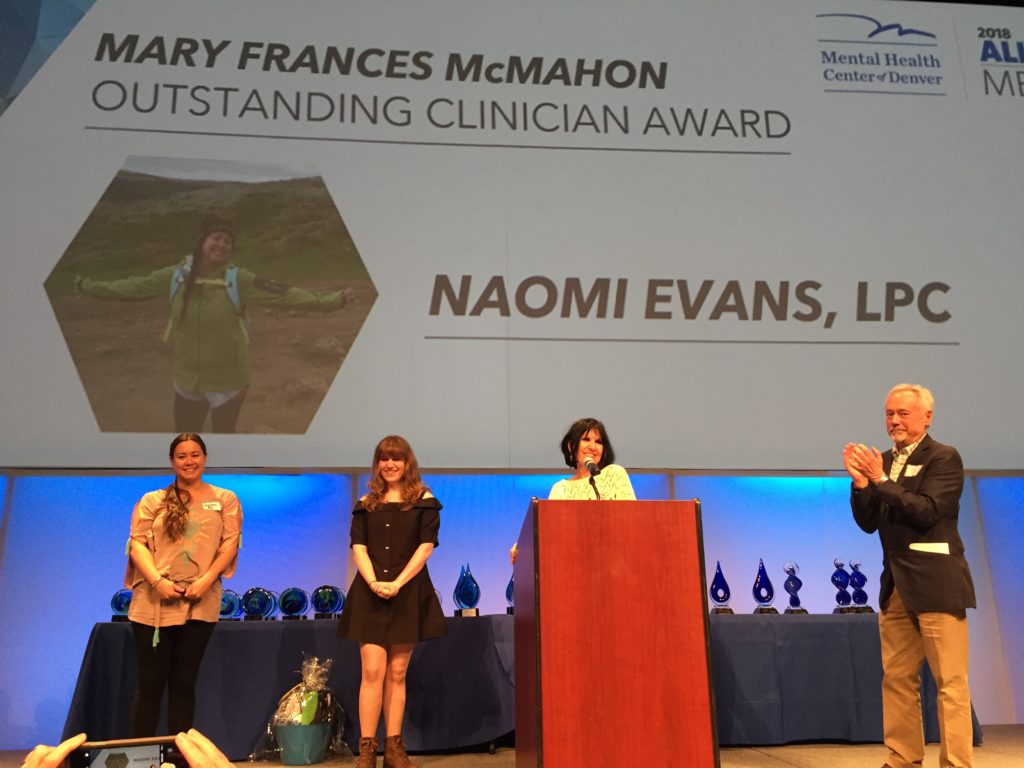 Dr. Kathy Giacomini, Alex Giacomini, and VP of Development Ric Durity present the first annual Mary Frances McMahon Outstanding Clinician Award to Naomi Evans, LPC, case manager at the Recovery Center.