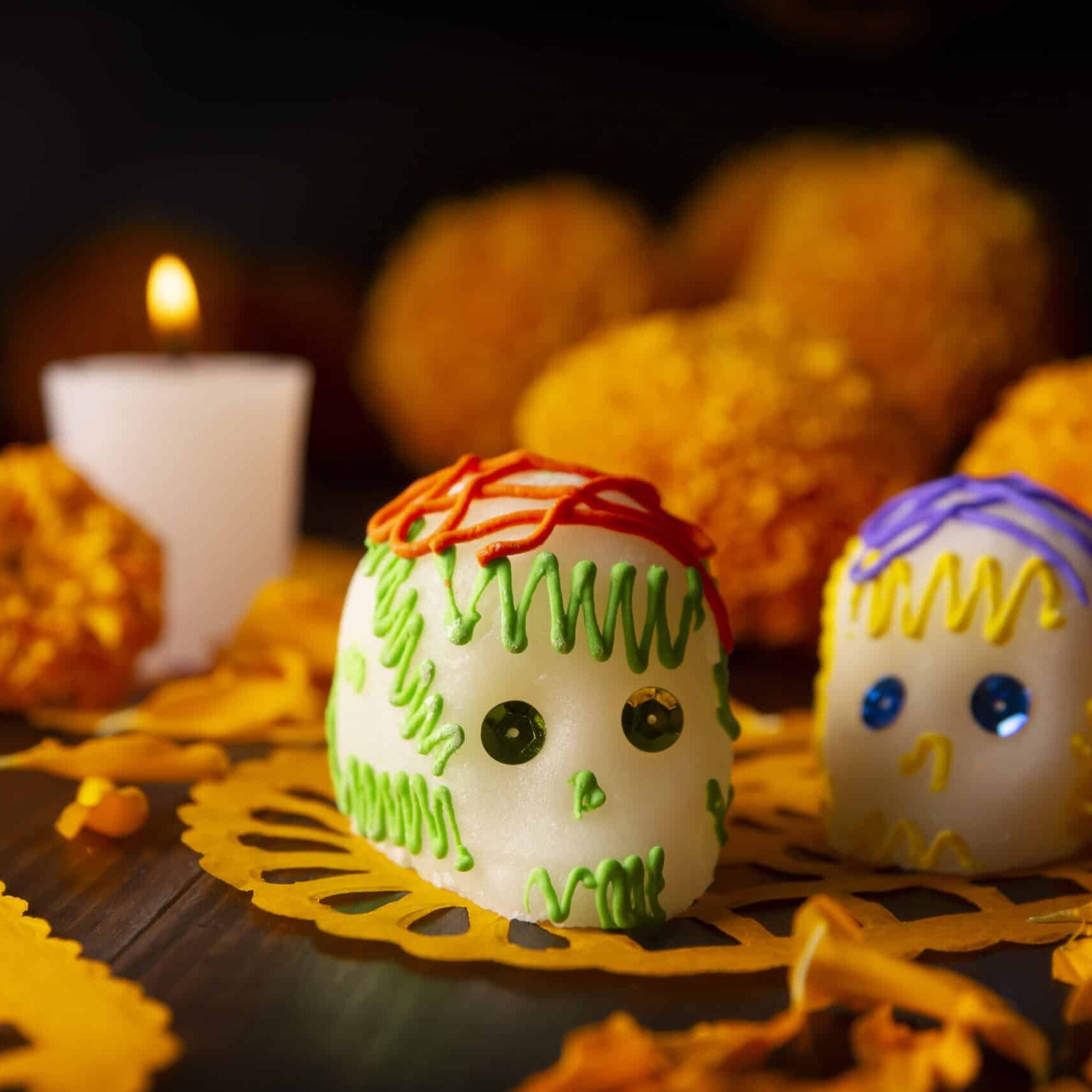 Sugar skull with Candles, Cempasuchil flowers or Marigold and Papel Picado. Decoration traditionally used in altars for the celebration of the day of the dead in Mexico